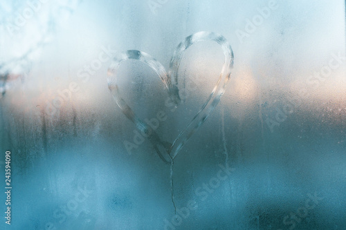 Frozen heart in window. Valentines day concept.