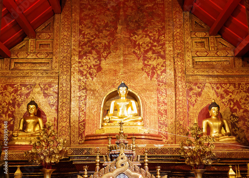 golden buddha figures in church photo