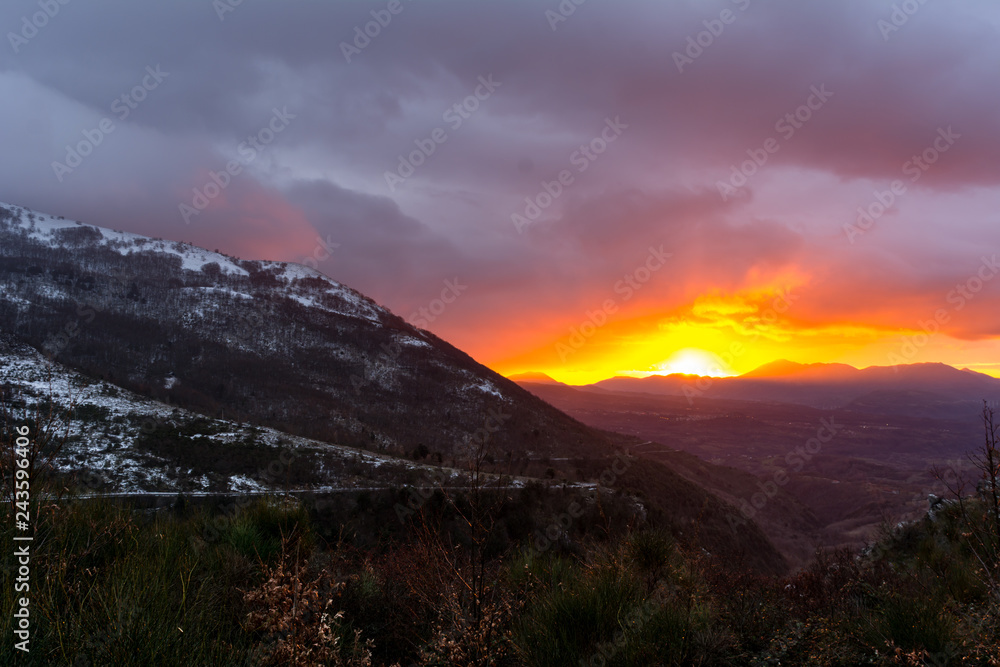 Mountain Landscape at Sunset on Cloudy Sky Background
