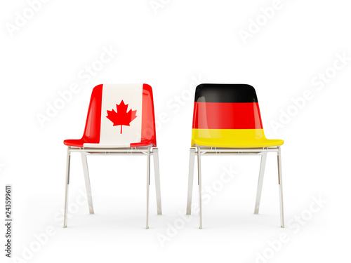 Two chairs with flags of Canada and germany isolated on white