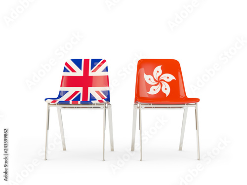 Two chairs with flags of UK and hong kong isolated on white