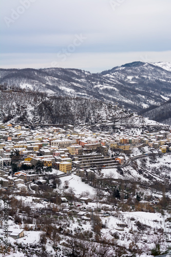 Vertical View of the town of Terranova di Pollino in Winter, Covered with Snow.