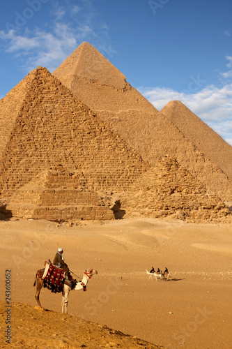 pyramids giza cairo in egypt with camel caravane panoramic scenic view