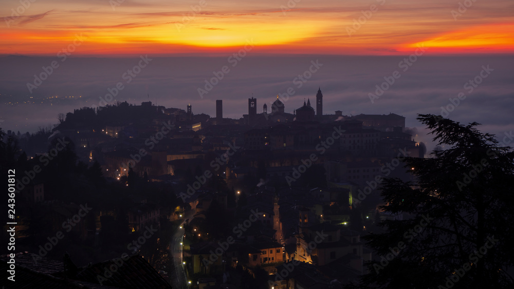 Bergamo, one of the most beautiful city in Italy. Lombardy. Amazing landscape of the fog rises from the plains and covers the old town at sunrise