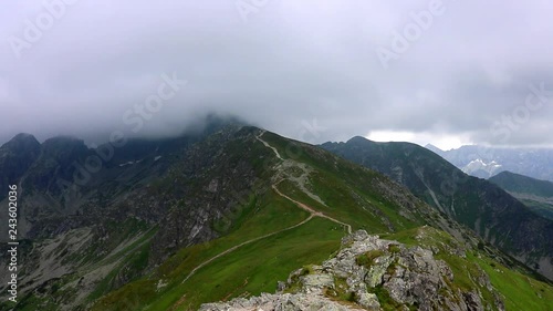 views of clouds passing over tatra mountains, poland