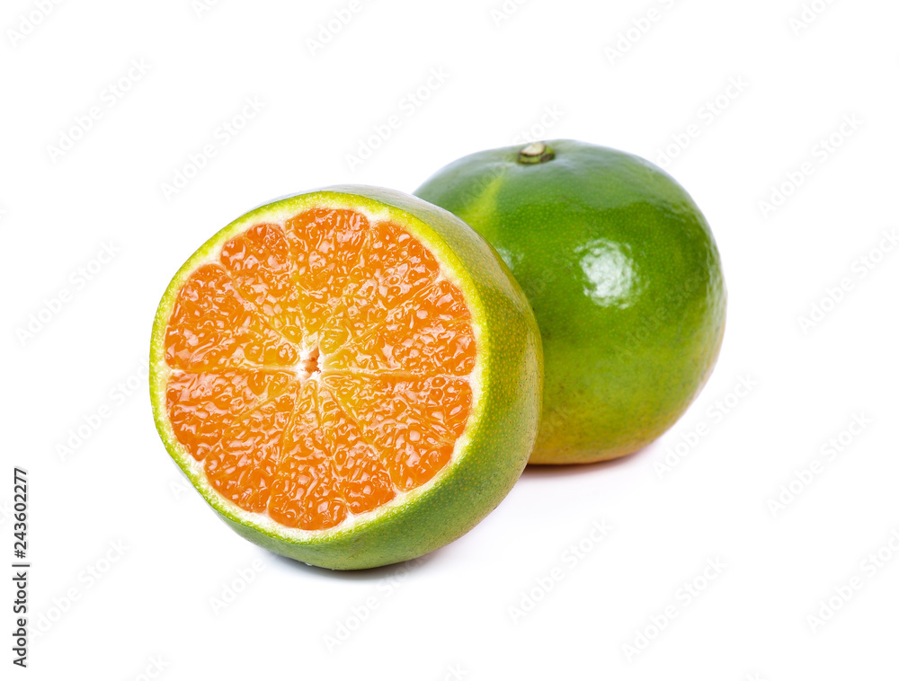 Fresh green tangerine that gives high vitamin C, isolated from the white background Fresh green tangerine that gives high vitamin C, isolated from the white background