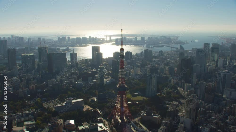 Tokyo, Japan circa-2018. Flying over city of Tokyo and Tokyo Tower. Shot from helicopter with RED camera.