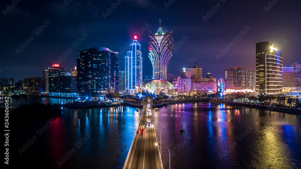 Fototapeta premium Macau cityscape at night, all hotel and tower are colorful lighten up with blue sky, Macau, China.