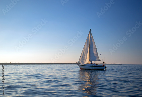 Sailboat leaving Channel Islands harbor in Oxnard California United States