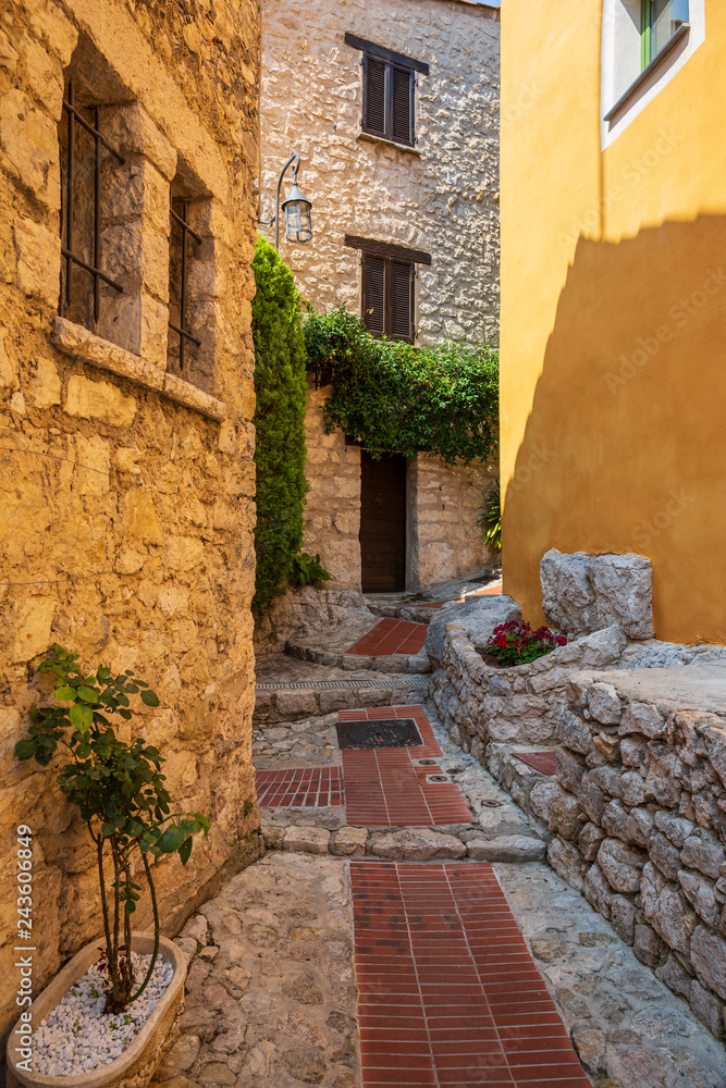 A charming stone building with flowers and plants in Eze, France