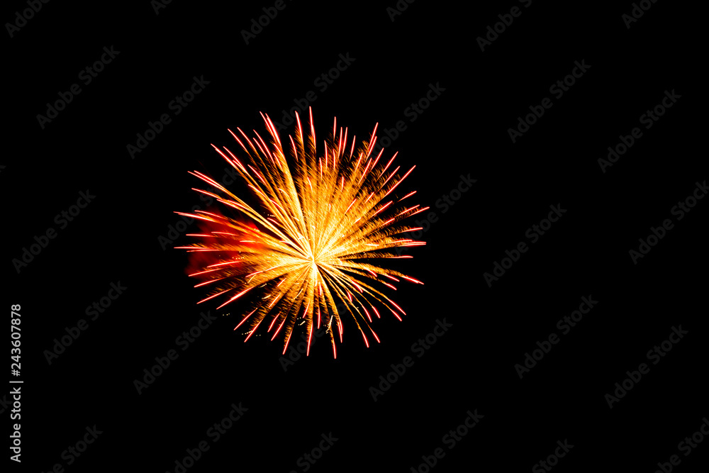 Single exploding firework with black background. Single exploding firework with black background.