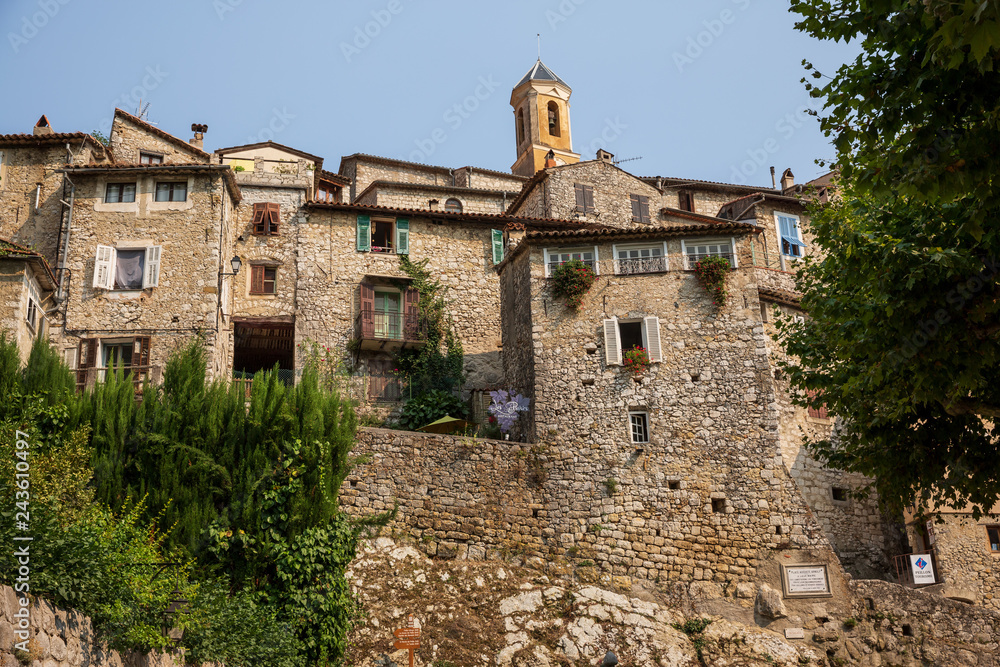 Restaurant sign and buildings in the beautiful hilltop village of Peillon in the Alpes-Maritime department of southeastern France