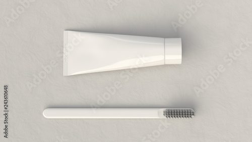 Blank white tube of toothpaste and toothbrush