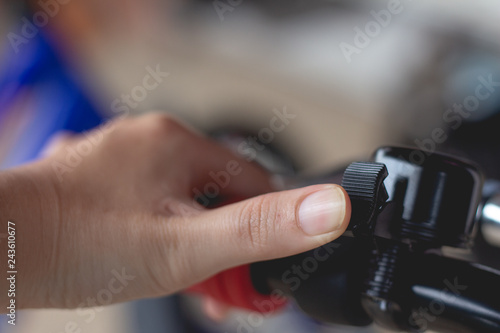 Close Up of woman hand with bicycle bell.