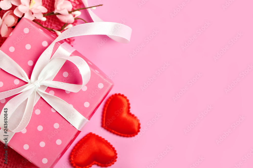 Fototapeta premium Greeting card on pink background. Selective focus. Valentines day, Womens day, Mothers day. Background with copy space. Horizontal.