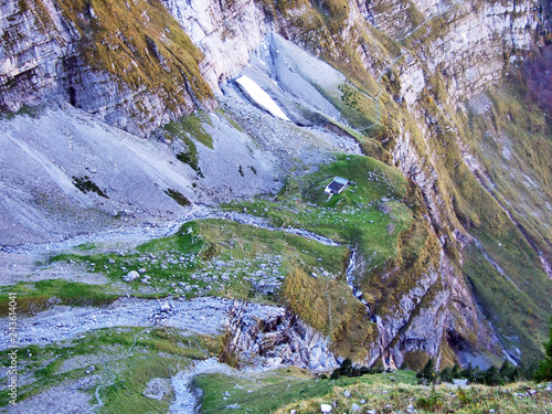 The rocks and stones of the Glarnisch and Vorder Glarnisch mountains above Lake Klontalersee - Canton of Glarus, Switzerland photo