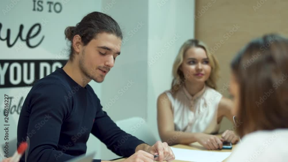 Business people meeting at boardroom table discussing financial report. Business people meeting at boardroom table discussing financial report.