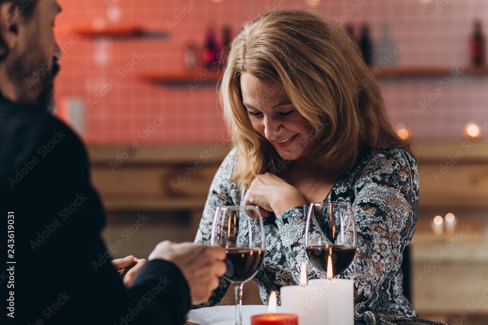 A middle aged couple have a romantic evening in a restaurant. A middle aged couple have a romantic evening in a restaurant.