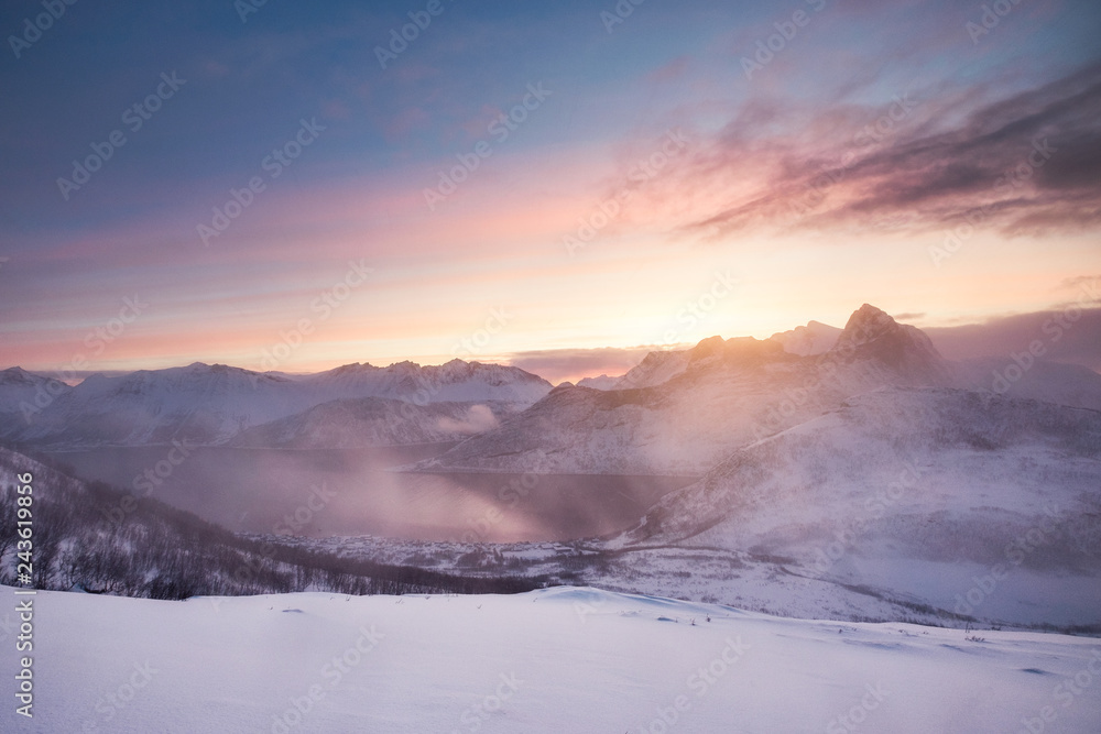 Colorful sunrise on snowy mountain