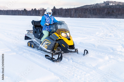 Athlete on a snowmobile.