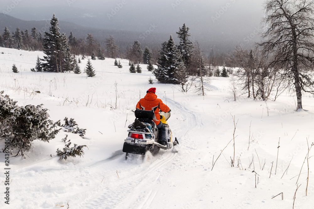 Athlete on a snowmobile. Athlete on a snowmobile.