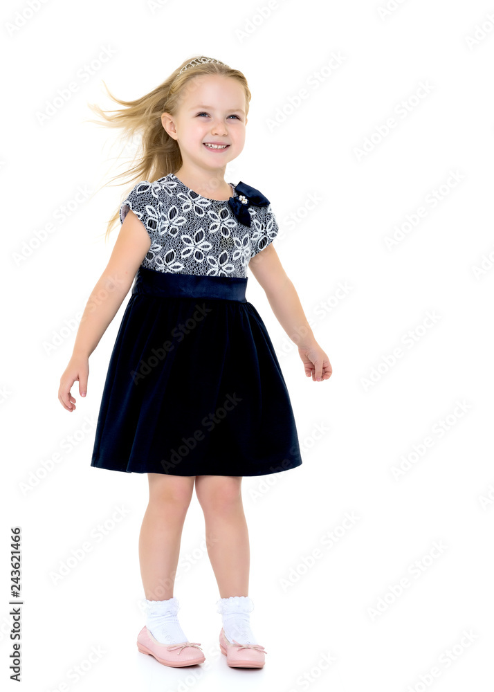 Little girl in a dress developing in the wind. Little girl in a dress developing in the wind.