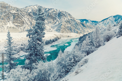 Winter snow river in mountains. Snow winter mountain river valley landscape. Winter snow river in winter snow mountain valley