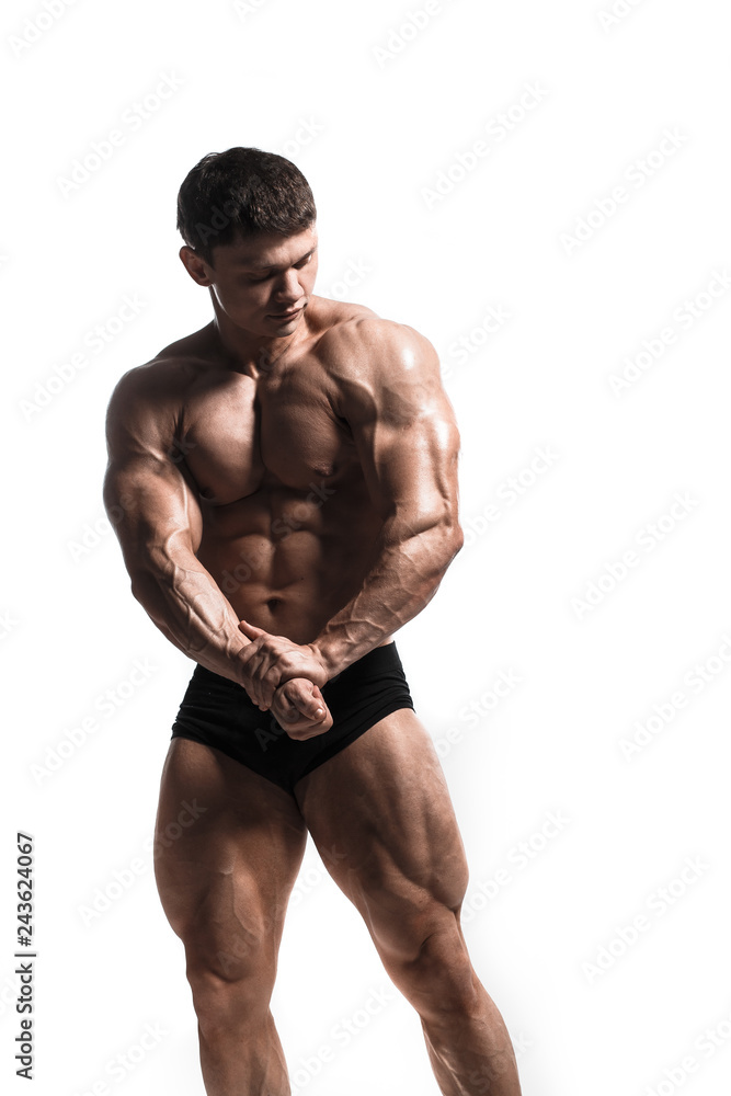 Handsome power athletic man pumping up muscles isolated over white. Strong bodybuilder with perfect shape body and six pack, abs, shoulders, biceps, triceps and chest. Handsome power athletic man pumping up muscles isolated over white. Strong bodybuilder with perfect shape body and six pack, abs, shoulders, biceps, triceps and chest.