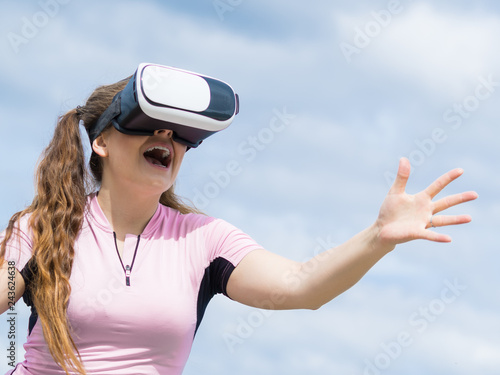 Woman wearing VR outside