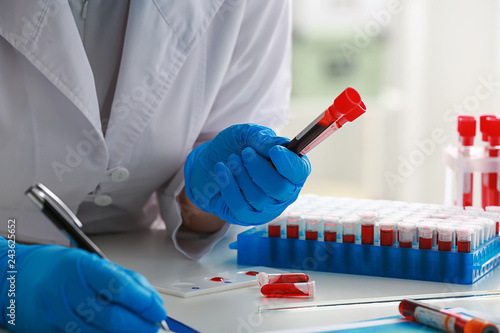 Woman working with blood sa...