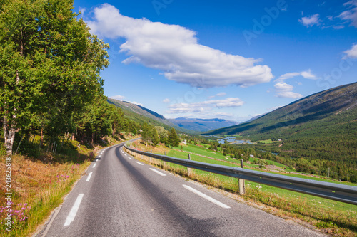 Scenic road along mountain valley in Oppland Eastern Norway photo