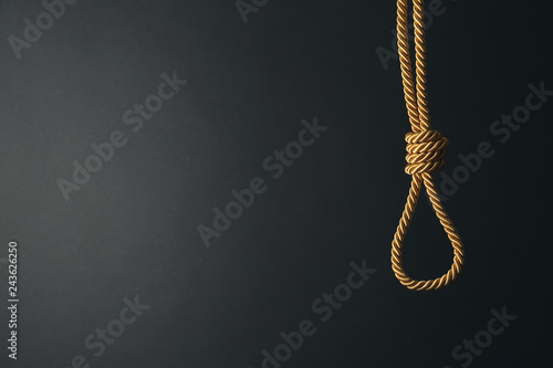 Rope with noose on dark background. Suicide awareness concept