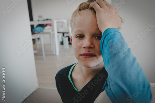 sad stressed little boy with injured face, bullying and violence