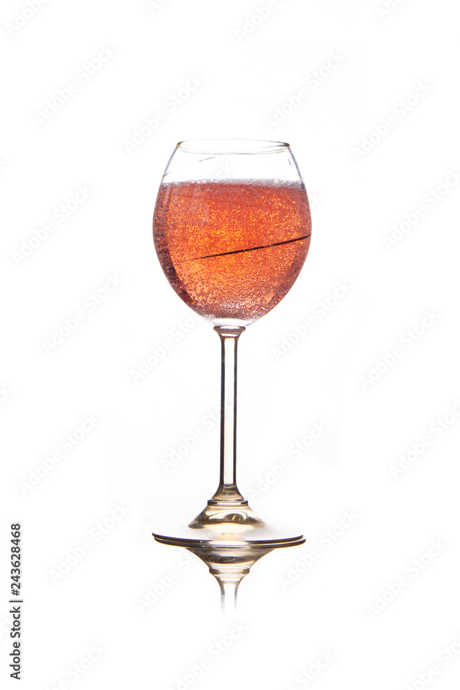 Rose pink champagne glass with bubbles isolated on white background Rose pink champagne glass with bubbles isolated on white background