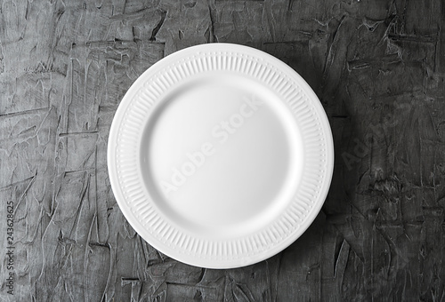 Empty ceramic plate on grey background