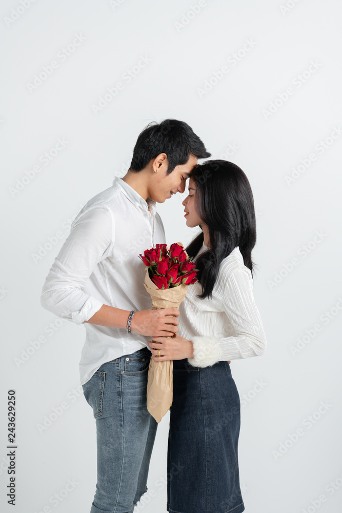 valentines day, love and people concept - happy couple with red heart shaped balloons, Roses, Big Red heart Paper over white background valentines day, love and people concept - happy couple with red heart shaped balloons, Roses, Big Red heart Paper over white background