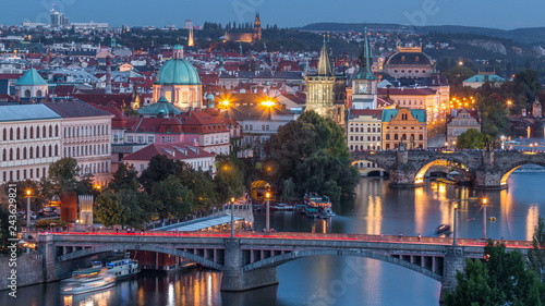 Aerial evening view of the Vltava River and illuminated bridges day to night timelapse, Prague