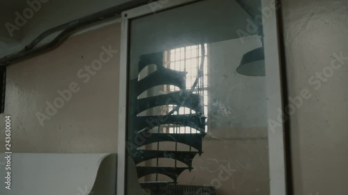 Stairs and window in mirror reflection at Alcatraz island, moving shot
