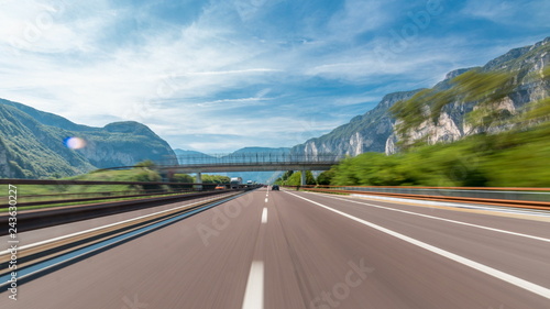 Driving on a highway through the mountains and meadows in Italy timelapse hyperlapse drivelapse