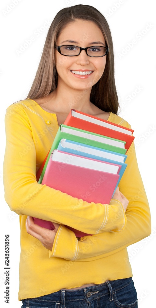 Beautiful young female student holding books Beautiful young female student holding books