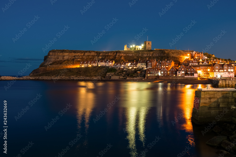 Evening in Whitby, North Yorkshire, England, UK - seen from the Pier Road