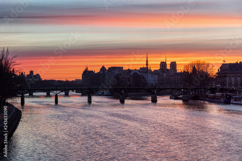 Sunrise over ile de la Cite in winter with Pont des Arts in foreground - Paris, France. HDR Timelapse Transition from Pont du Carrousel.