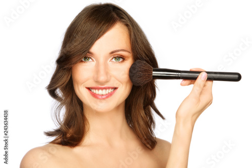 Woman applying make-up