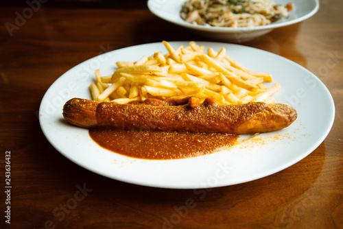 Grilled sausage served with french fries