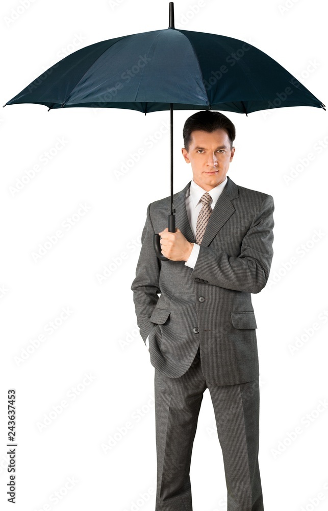 Businessman holding an unbrella - isolated image Businessman holding an unbrella - isolated image