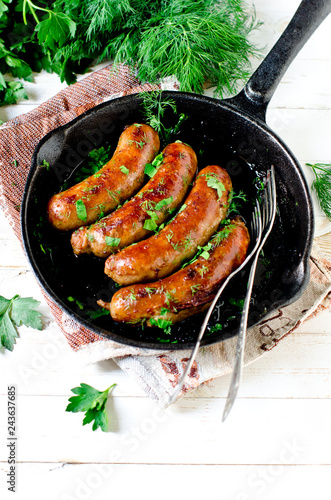 Homemade sausages from turkey (chicken) fried in a frying pan 