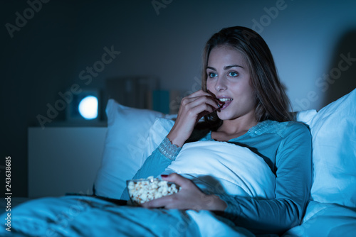 Woman watching movies on tv