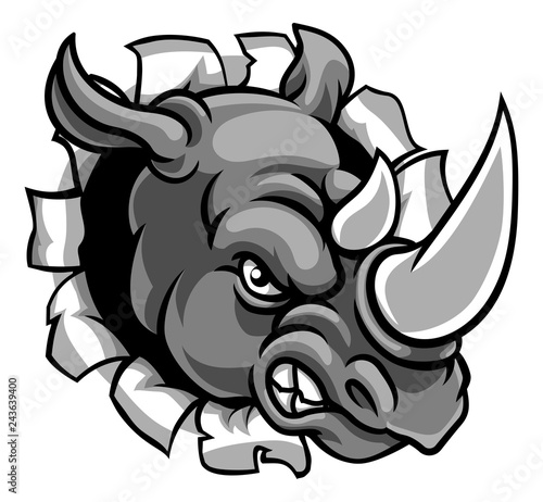 A rhinoceros or rhino angry mean animal sports mascot cartoon head breaking through the background
