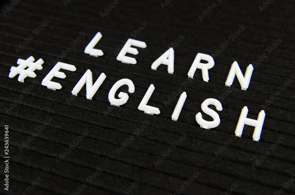 Learn English language, modern looking sign on black background Learn English language, modern looking sign on black background