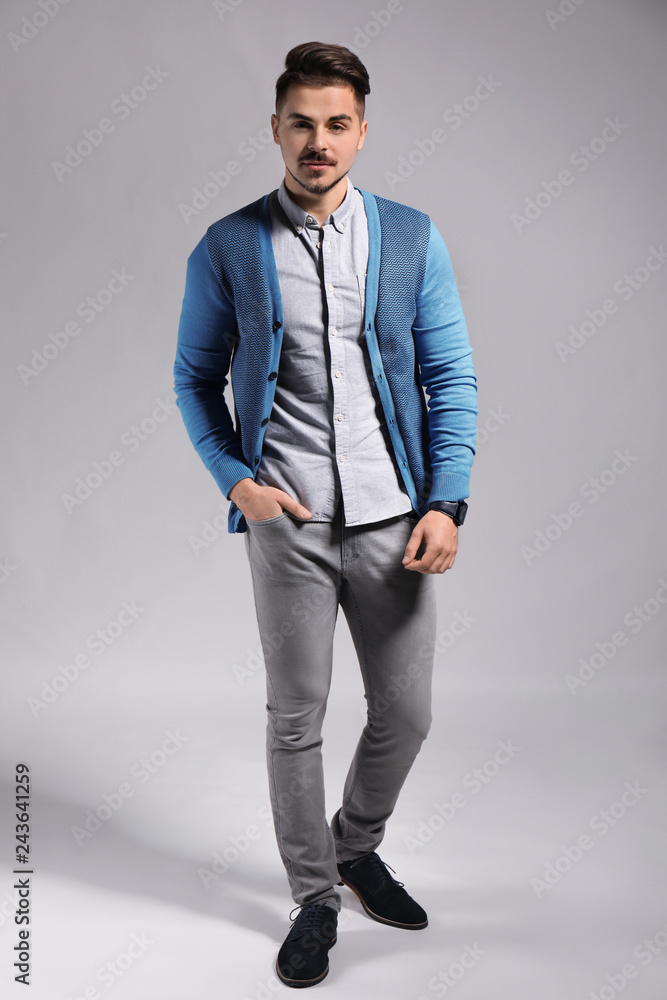 Handsome young man on grey background Handsome young man on grey background
